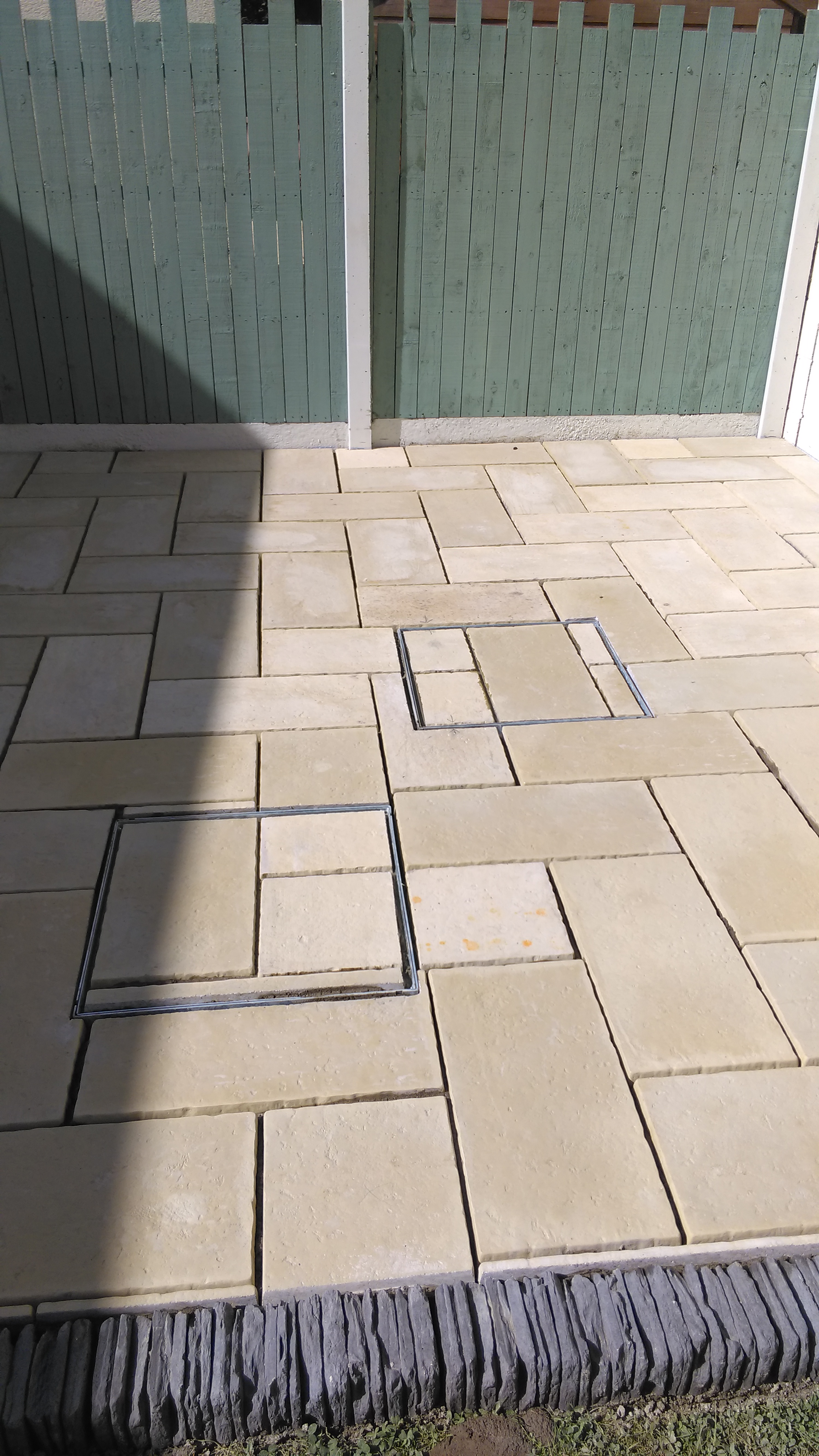 Patio with 2 covered ajays and white tiles