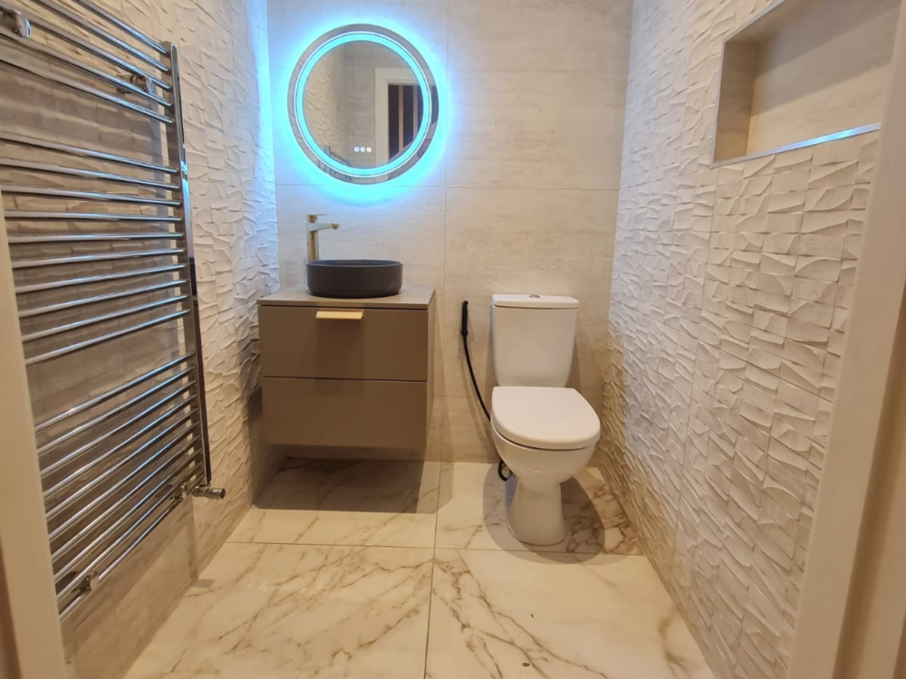 Custom Built Bathroom with a blue backlight on a mirror