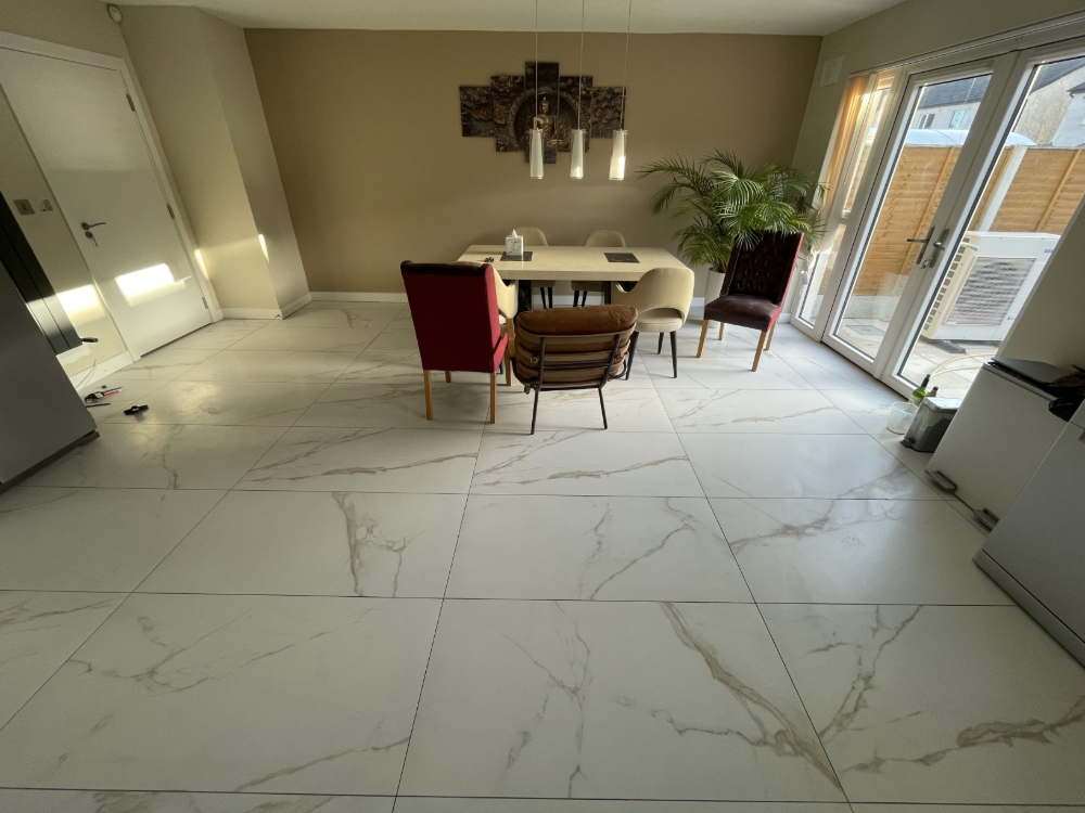 Custom done kitchen showcasing a table centered by chairs